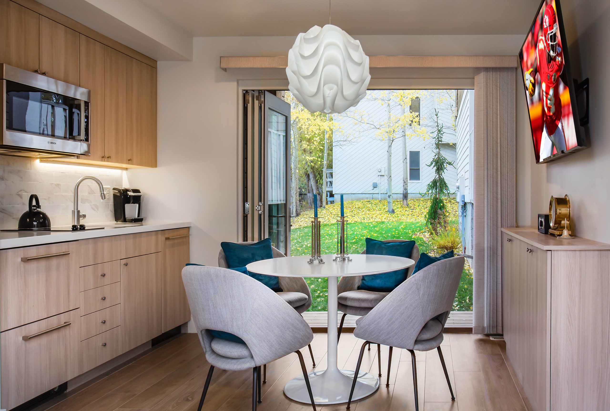 Kitchen and dining room in the Granny Pod in Park City, Utah, architectural design by Elliott Workgroup