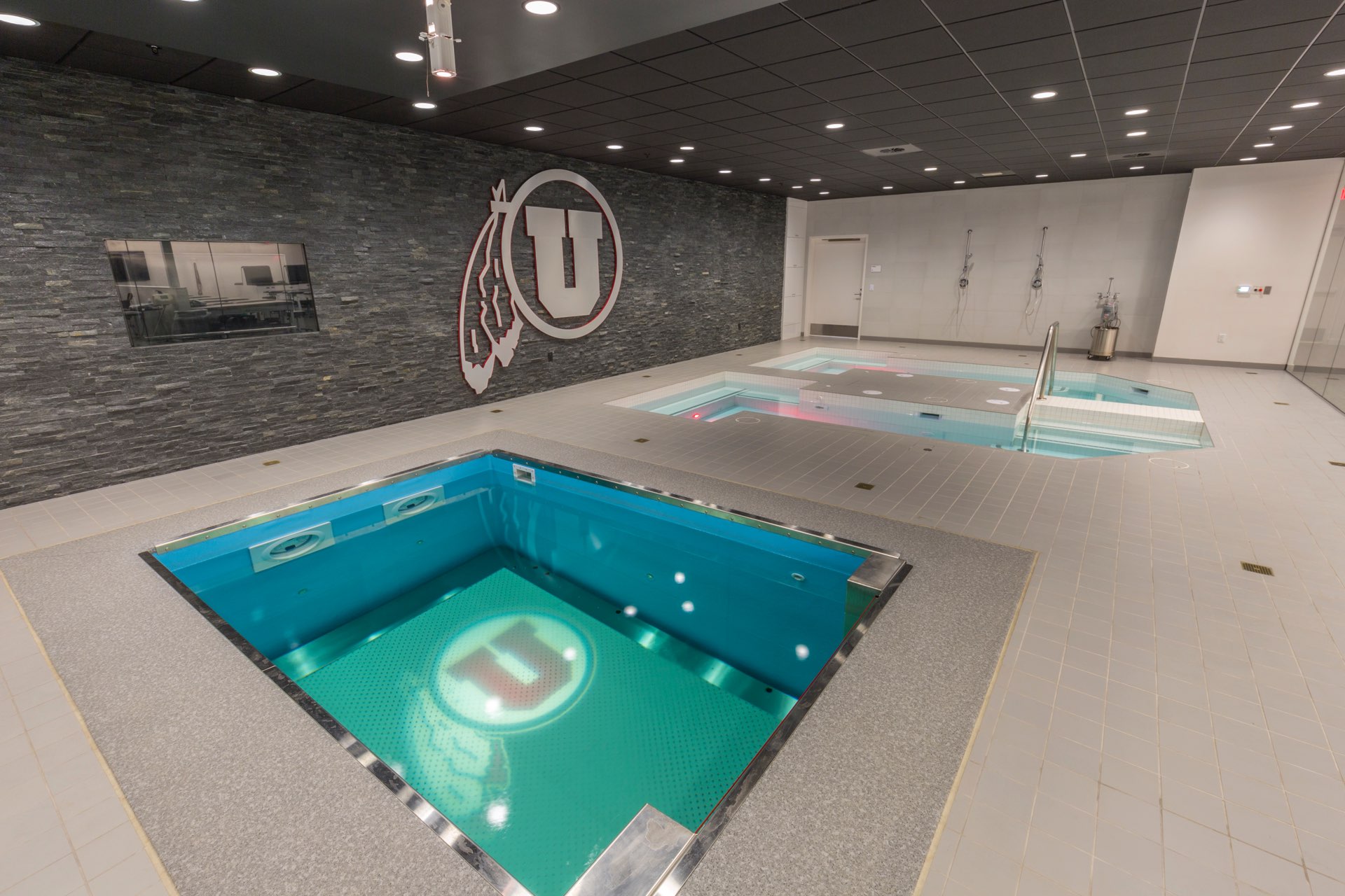 Hot tubs inside the University of Utah Basketball Interior, interior design by Elliott Workgroup