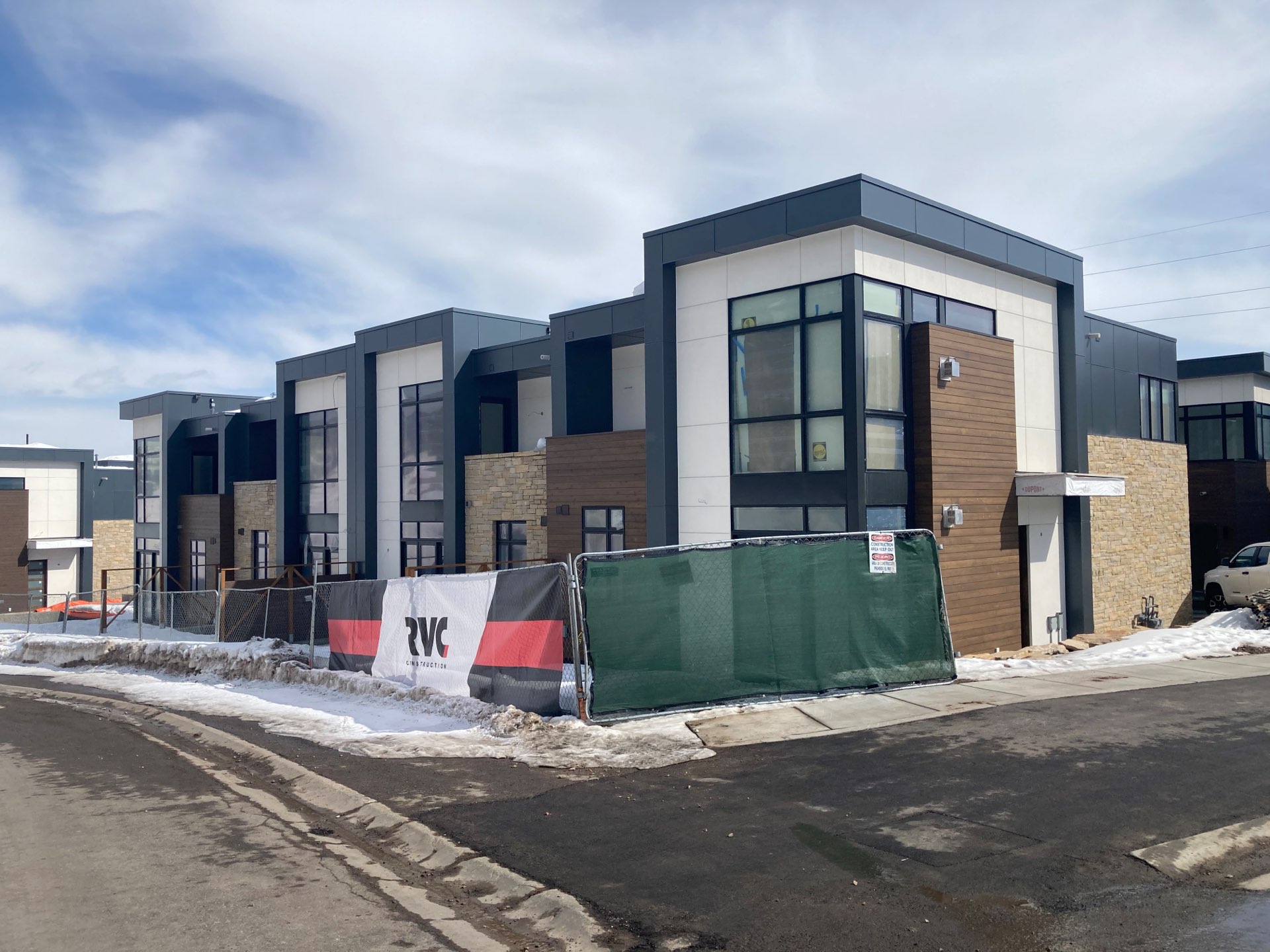 Unfinished exterior of Viridian Townhomes at Canyons Village in Park City, Utah, architectural design by Elliott Workgroup