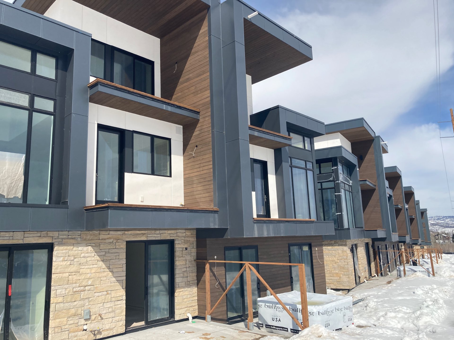 Unfinished exterior of Viridian Townhomes at Canyons Village in Park City, Utah, architectural design by Elliott Workgroup
